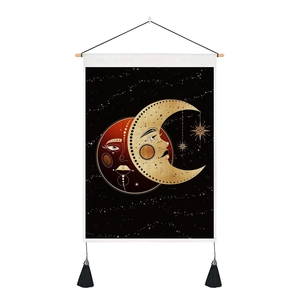 Detail view of Bohemian sun and moon tapestry with wooden rod and black tassels
