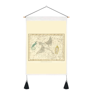 Close-up of vintage celestial star map tapestry with wooden pole and black hanging tassels