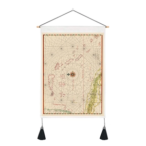 Detail of vintage nautical map tapestry featuring wooden rod and black tassels