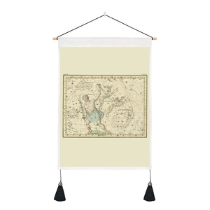 Detail of vintage astronomical tapestry with wooden rod and black tassels on white background