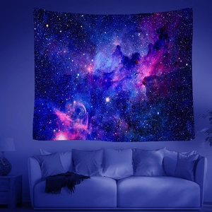 Detail of artistic starry sky tapestry with vibrant nebula print for wall decoration