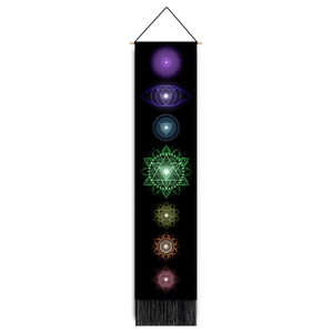 Detail view of Bohemian Seven Chakra tapestry with colorful symbols and black tassels