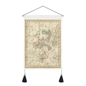 Detailed close-up of vintage celestial map tapestry with wooden rod and black tassels