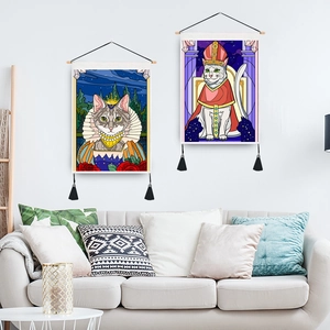 Two-piece cat tapestry set with wooden rods and black tassels on a white living room wall