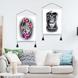 Japanese style Buddhist wall tapestries with wooden rod and black tassels on a white wall