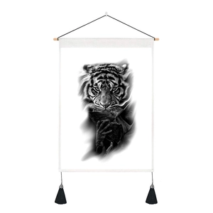 Detail of tiger art wall hanging with wooden rod and black decorative tassels on canvas