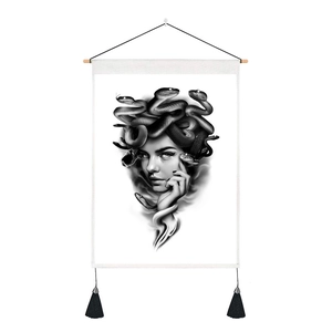 Detail of Medusa black and white wall art with cotton linen texture and black tassels