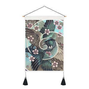 Close-up of Japanese tapestry with kingfisher and cherry blossom print and black tassels