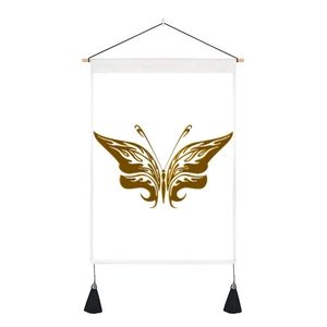 Detail of artistic gold butterfly tapestry with wooden hanging rod and black tassels