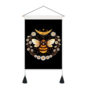 Detail of vintage wall tapestry with bee, lunar moon, and daisies on black background