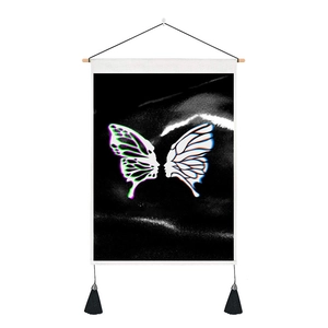 Macro detail of butterfly tapestry with face profiles on canvas with wooden hanger