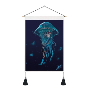 Detail of 3D jellyfish and siren tapestry featuring wooden hanging pole and black tassels