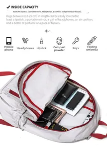 Detail view of foldable light grey backpack interior capacity with red zipper accents
