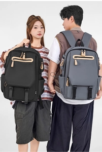 Detail view of large capacity travel backpacks in black and grey for students