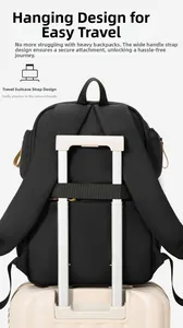 Detail of the luggage trolley sleeve on a black backpack for easy travel attachment