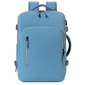 Detail view of the multi-pocket design and water-resistant fabric on this blue laptop bag