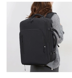 Detail view of black commuter laptop backpack with USB port and multiple compartments