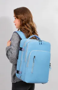 Professional light blue waterproof laptop backpack shown during wear by a model