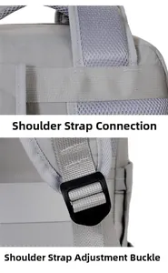 Detail of breathable mesh shoulder strap and adjustable buckle on grey business backpack
