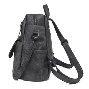 Detail view of the durable dark grey PU leather backpack side with D-ring and strap