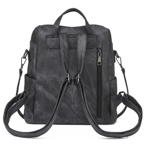 Macro view of water-washed texture PU leather backpack with anti-theft zipper on back