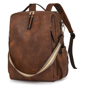 Detail view of brown PU leather business backpack with adjustable straps and side pocket