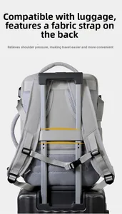 Waterproof travel backpack detail showing luggage strap fixed on suitcase handle