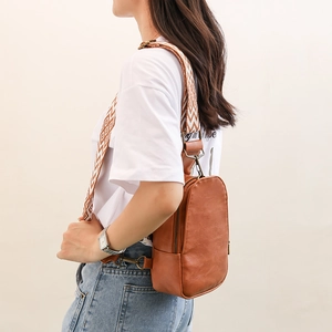 Side view of vintage brown PU leather chest bag with ethnic geometric wide shoulder strap