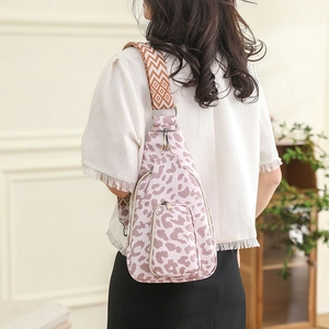 Close-up of leopard print chest bag with vintage ethnic geometric wide strap