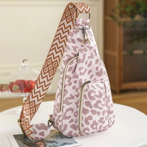 Detail of pink leopard print PU chest bag with adjustable geometric pattern strap