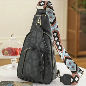 Close-up of leopard print chest bag with adjustable bohemian geometric woven strap
