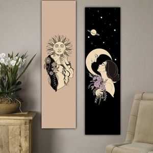 Detail view of modern line art sun and moon wall tapestries in a cozy living room setting