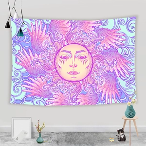 Detail of bohemian sun tapestry with purple wings and abstract art in a cozy bedroom