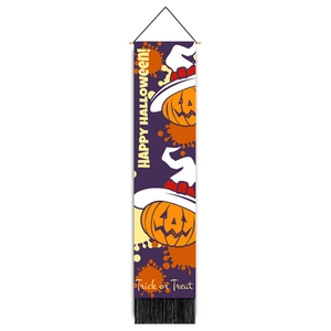 Close-up of purple Halloween wall banner with pumpkin, wooden rod, and black fringe detail
