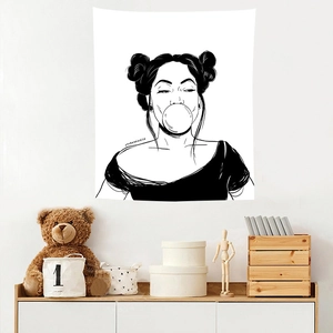 Detail of minimalist black and white wall tapestry with woman blowing bubble gum pop art