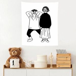 Close-up of black and white minimalist wall tapestry with artistic figure illustrations