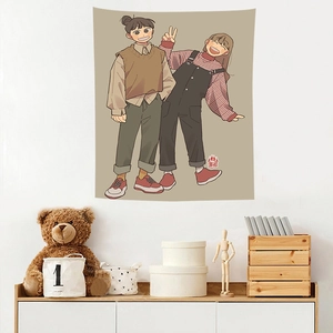 Detail of hanging wall tapestry with anime girls illustration in cozy bedroom decor