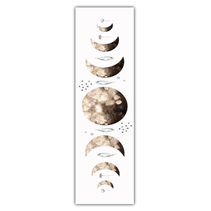 Macro detail of moon phase tapestry featuring watercolor textures and floral accents