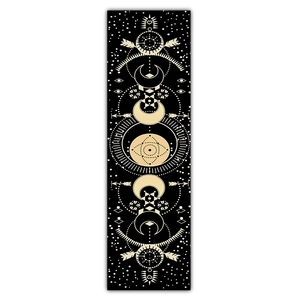Close-up of bohemian lunar eclipse tapestry with gold celestial geometry patterns