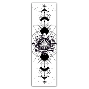 Detailed view of bohemian lunar eclipse tapestry with sun and moon celestial graphics