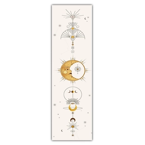 Detail of bohemian tapestry featuring sun, moon phases, and mystical astrology patterns