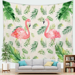 Detail of tropical flamingo wall tapestry above a grey sofa in a minimalist room
