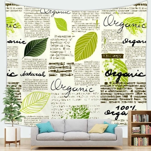 Detail of tropical plant tapestry with organic lettering displayed above a sofa