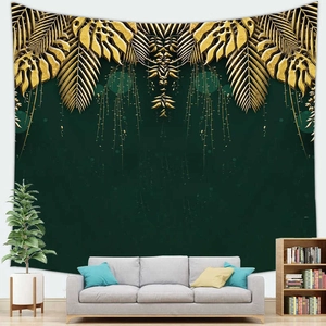Detail of dark green tropical tapestry with gold palm leaves and tassels on white wall