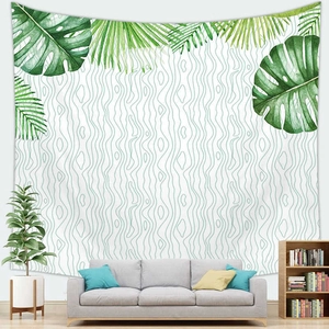 Detail showing tropical monstera leaf wall tapestry in a modern living room setting