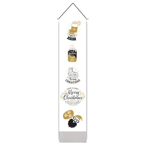 Detail of Christmas wall hanging with black and gold holiday patterns on white fabric