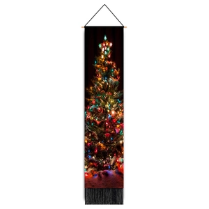 Detail of Christmas tree wall hanging with wooden rod, festive lights and black tassels