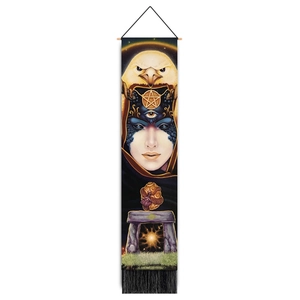 Macro view of fantasy tapestry featuring eagle, mystic face, dragon egg and black tassels