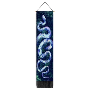 Vertical wall tapestry with blue snake print on tropical leaves background and black tassels