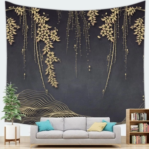 Detailed view of black and gold floral tapestry hanging behind a modern gray sofa